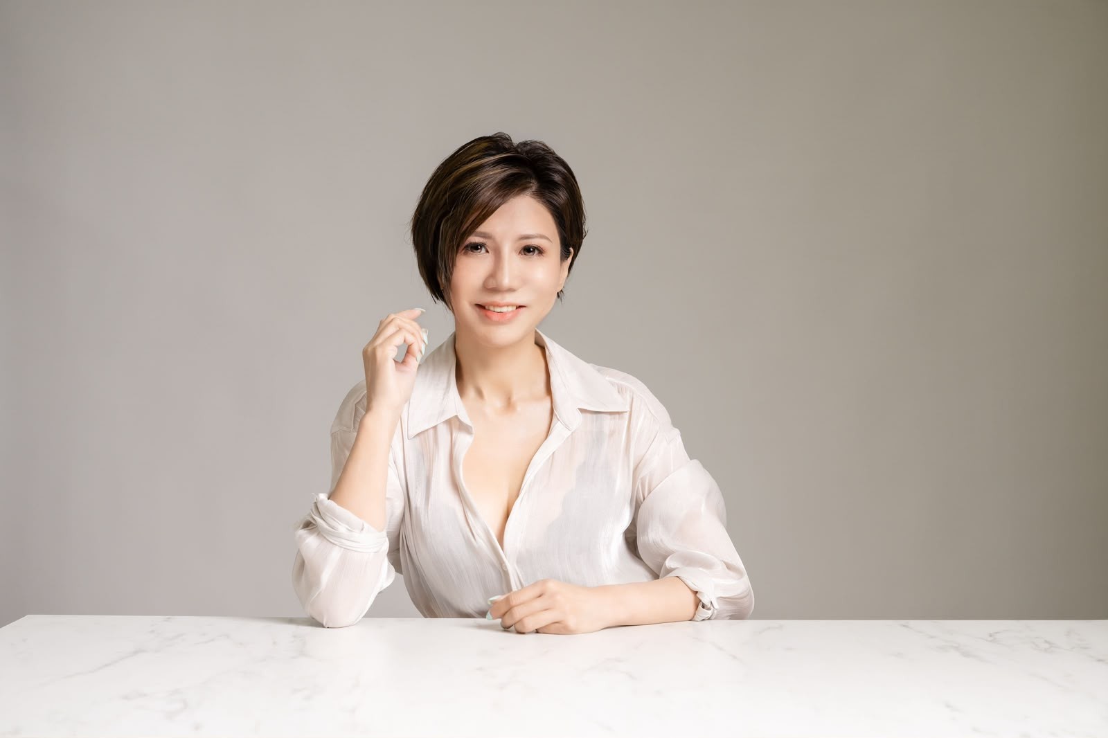 Maggie, BOWA brand director, in a white shirt at a studio table